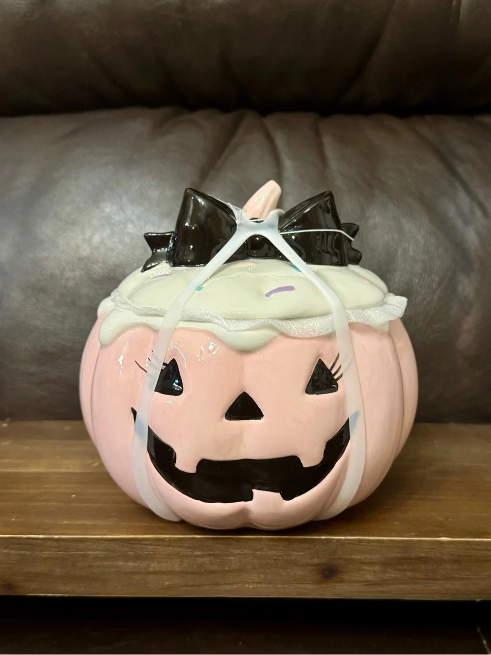 Pink pumpkin cookie jar with bow